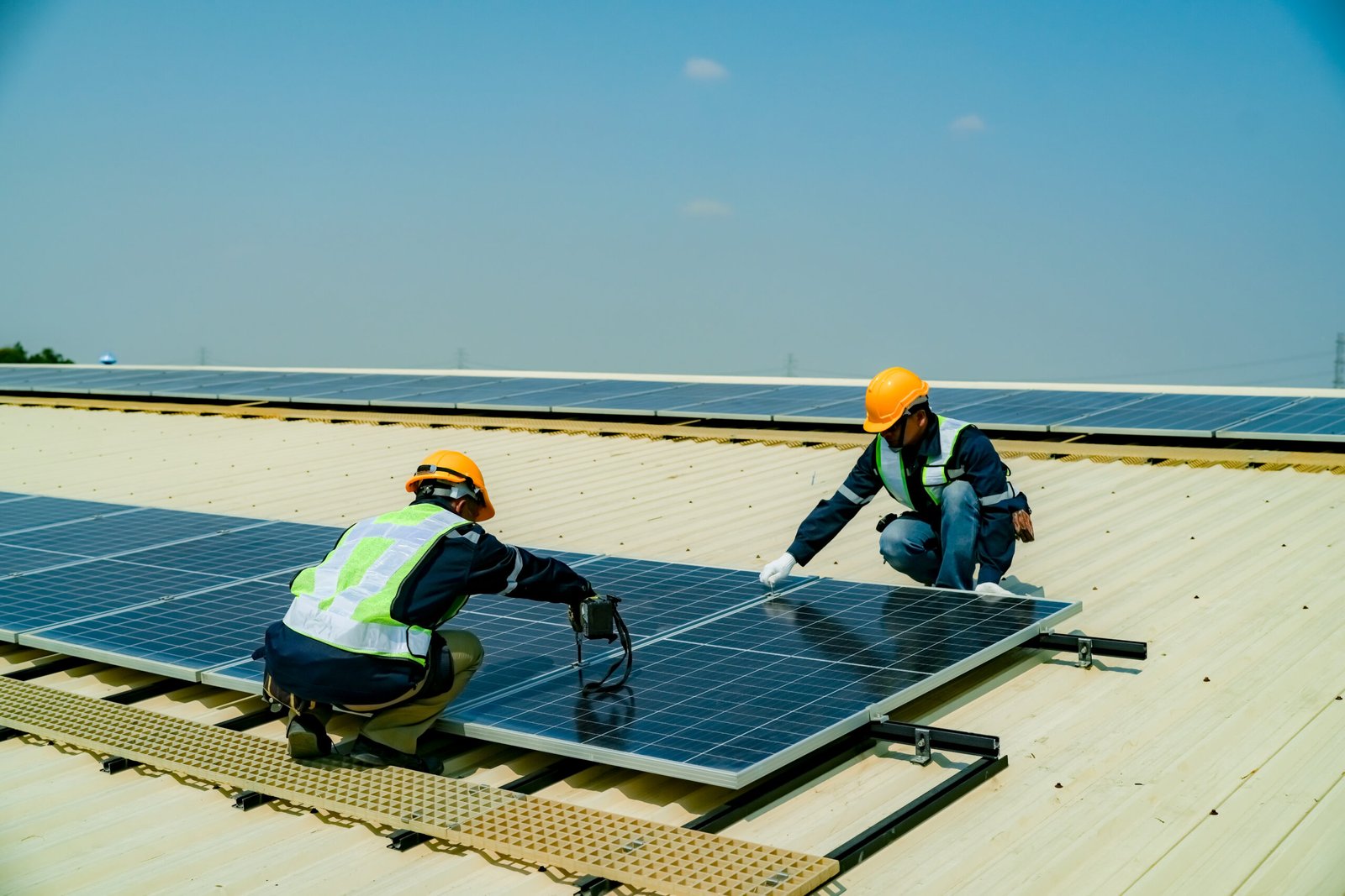 AP Sun Energy installers working on a commercial solar panel installation, ensuring efficient and sustainable energy solutions.