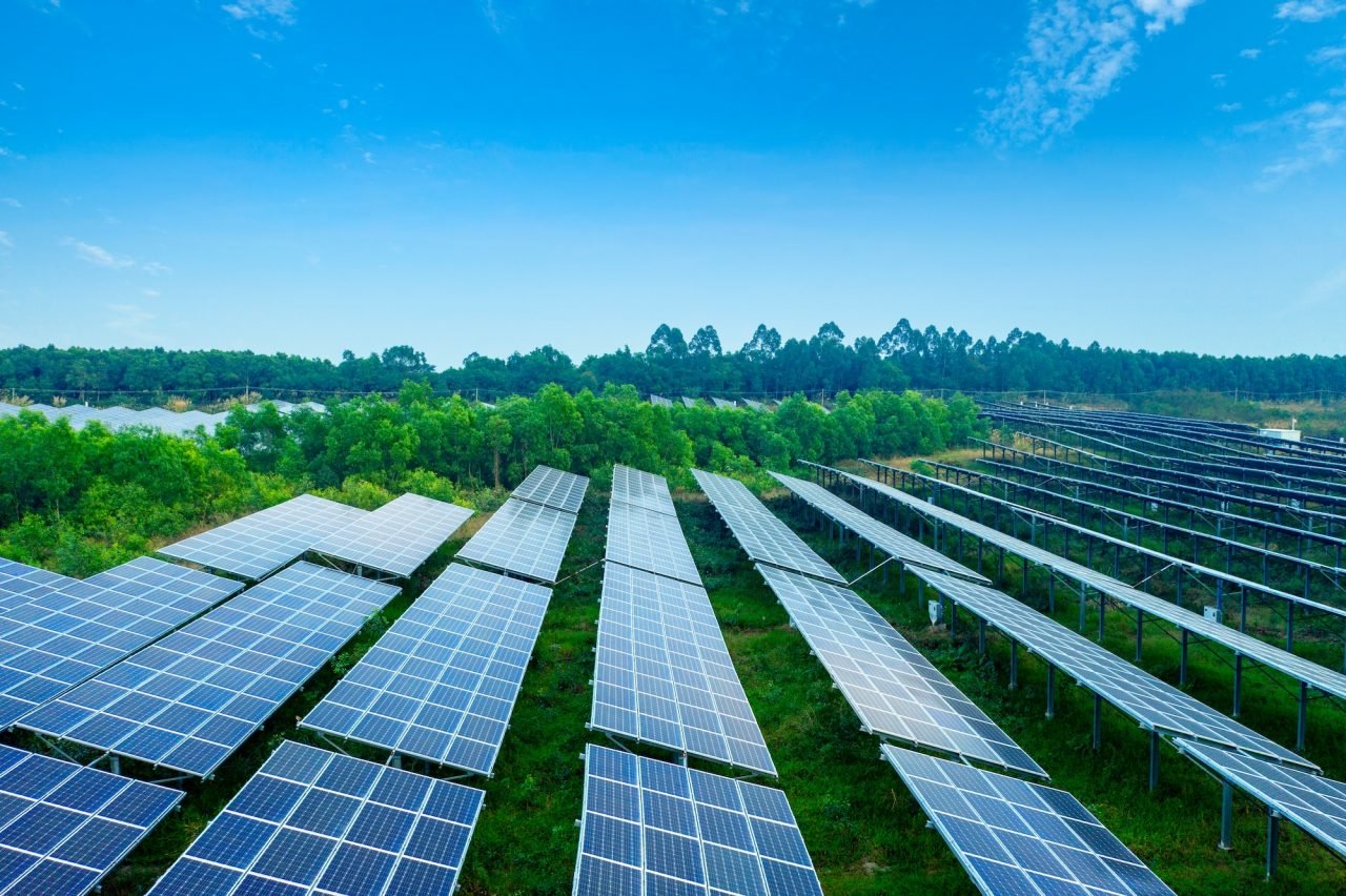 A commercial property with ground-mounted solar panels installed nearby by AP Sun Energy, providing efficient and sustainable energy solutions