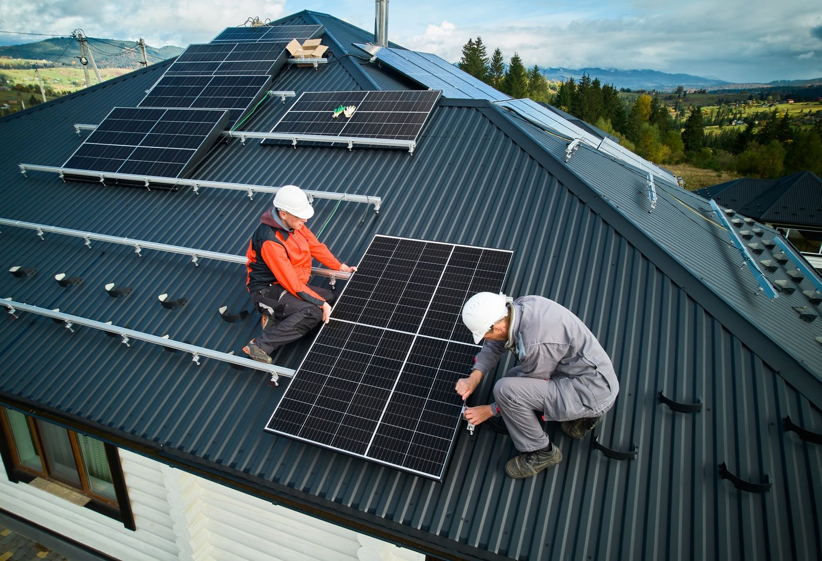 echnicians from AP Sun Energy installing solar panels on a residential rooftop under a bright blue sky, demonstrating professional renewable energy solutions