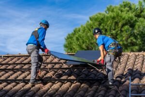 Workers installing solar panels